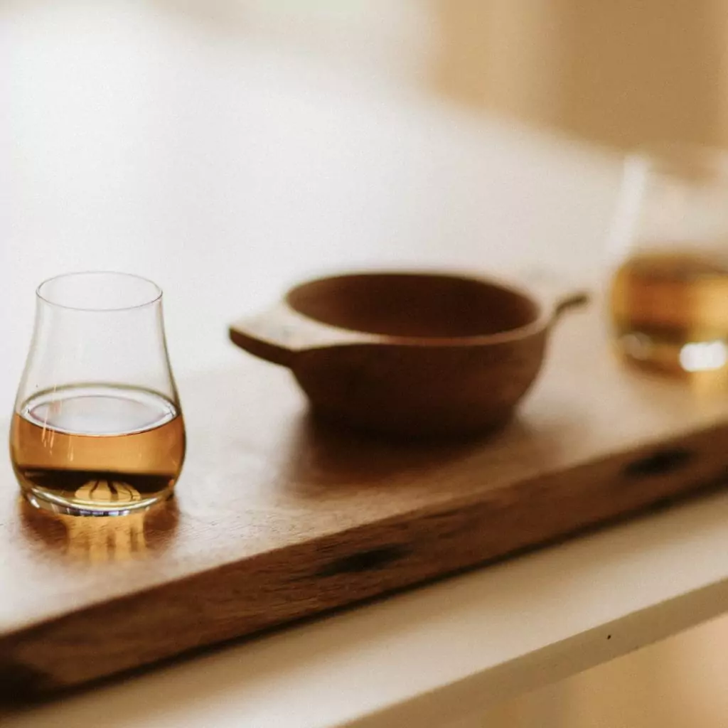 Handcrafted wooden quaich and tray with two spey glasses. Designed as a wedding centrepiece these have been set on a reclaimed oak whisky barrel lid