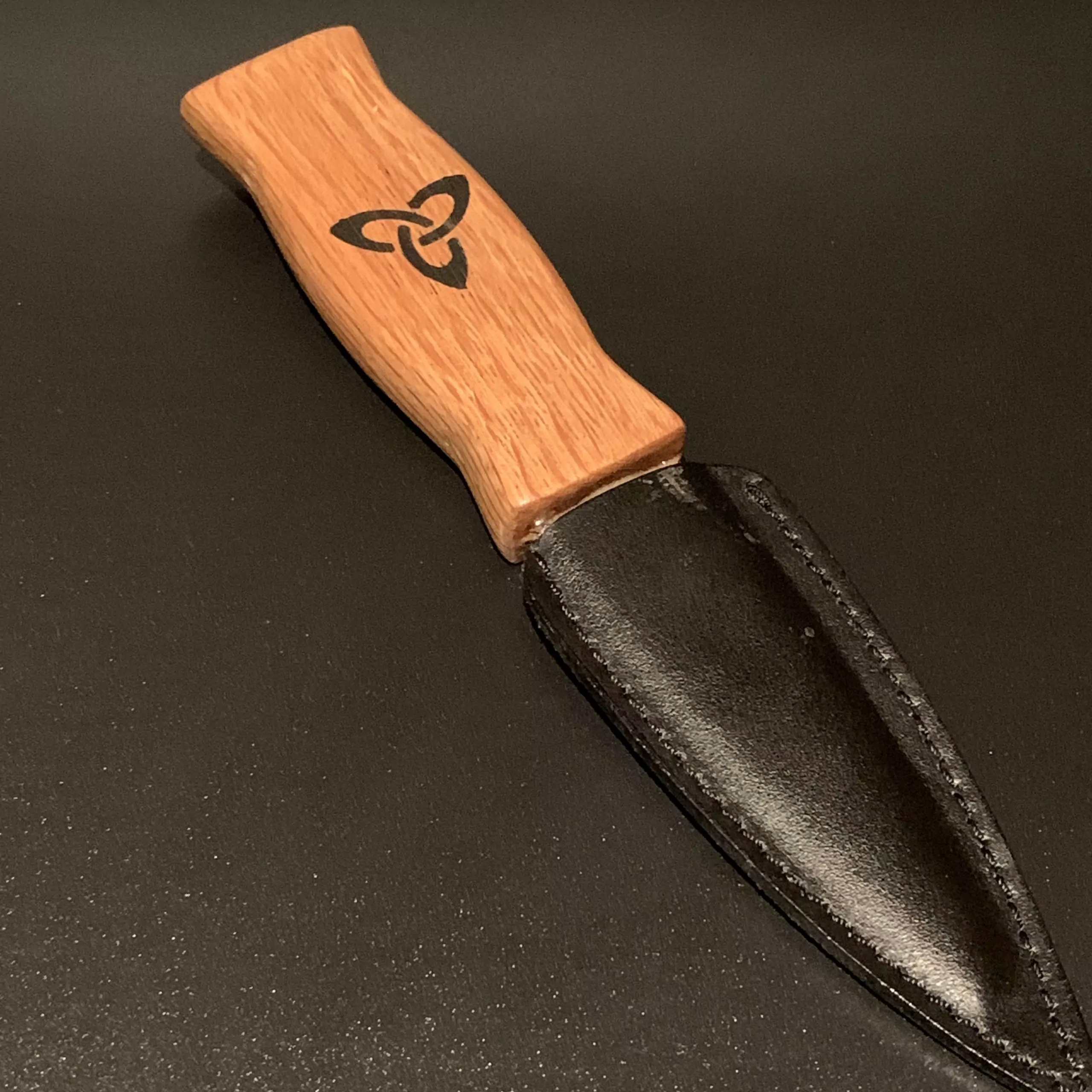 A traditional Oak Sgian Dubh handcrafted from an authentic reclaimed Scottish whisky stave
