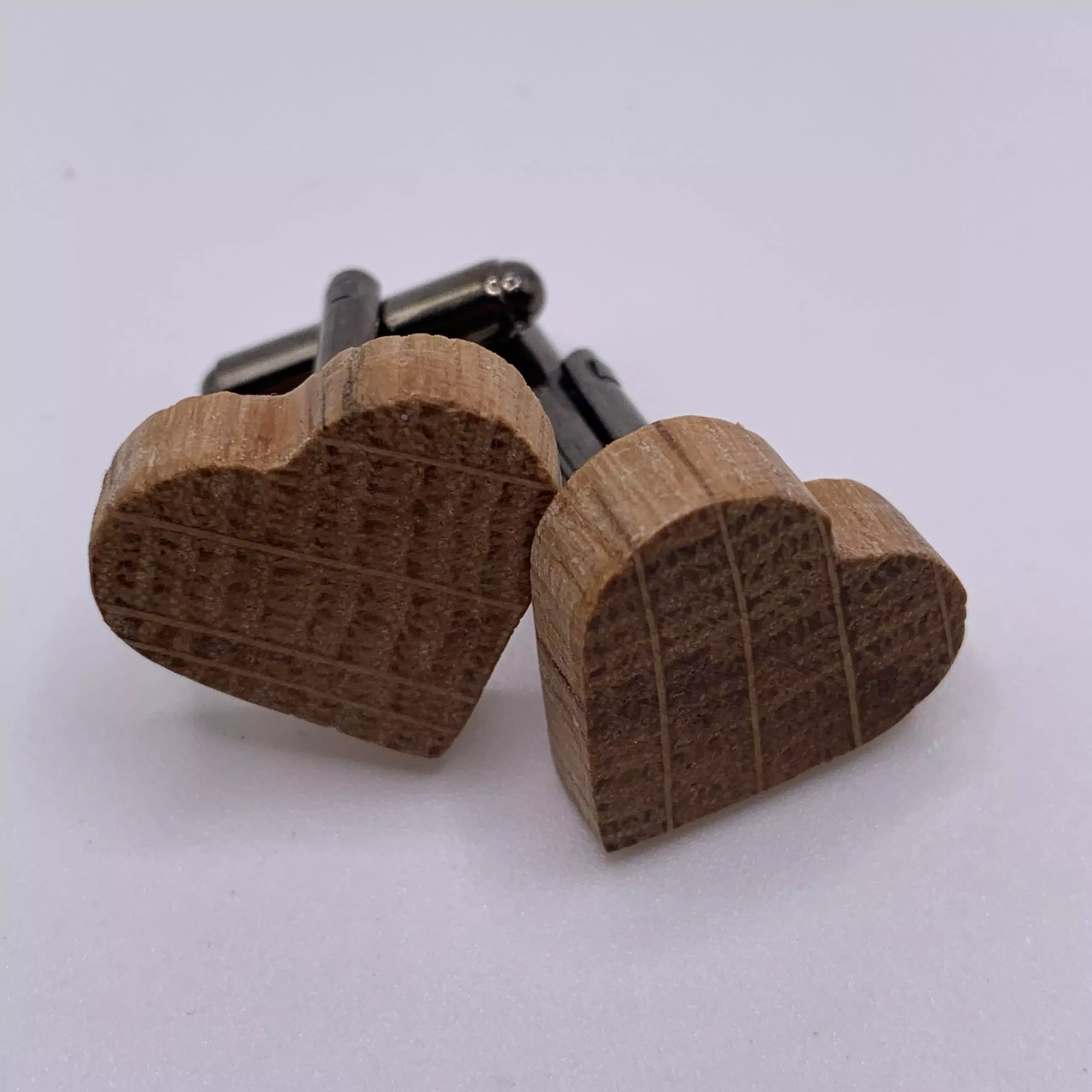 Heart shaped oak cufflinks handcrafted from a reclaimed whisky barrel stave