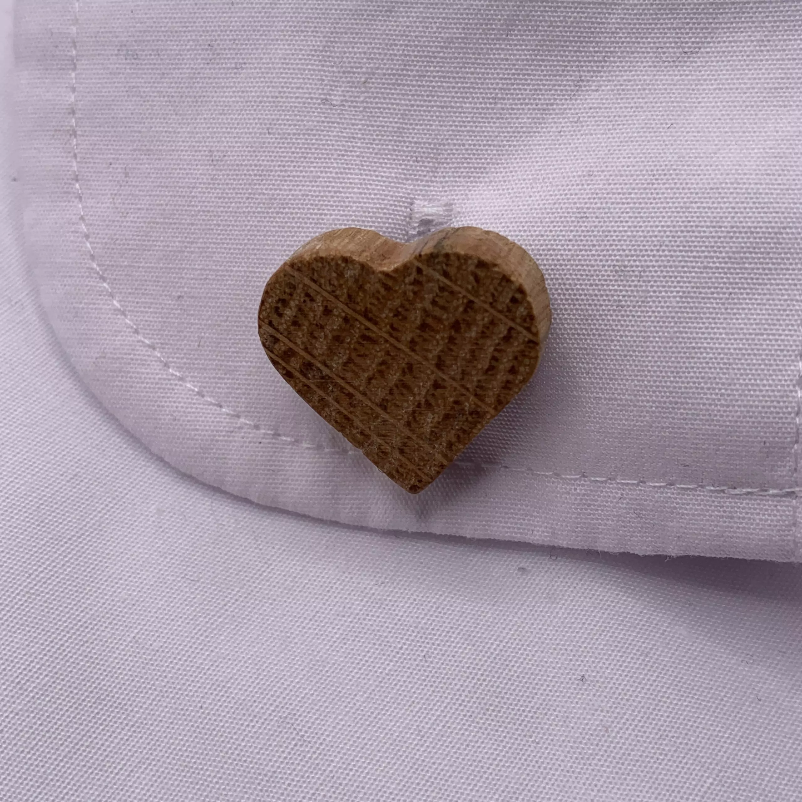 Heart shaped oak cufflinks handcrafted from a reclaimed whisky barrel stave