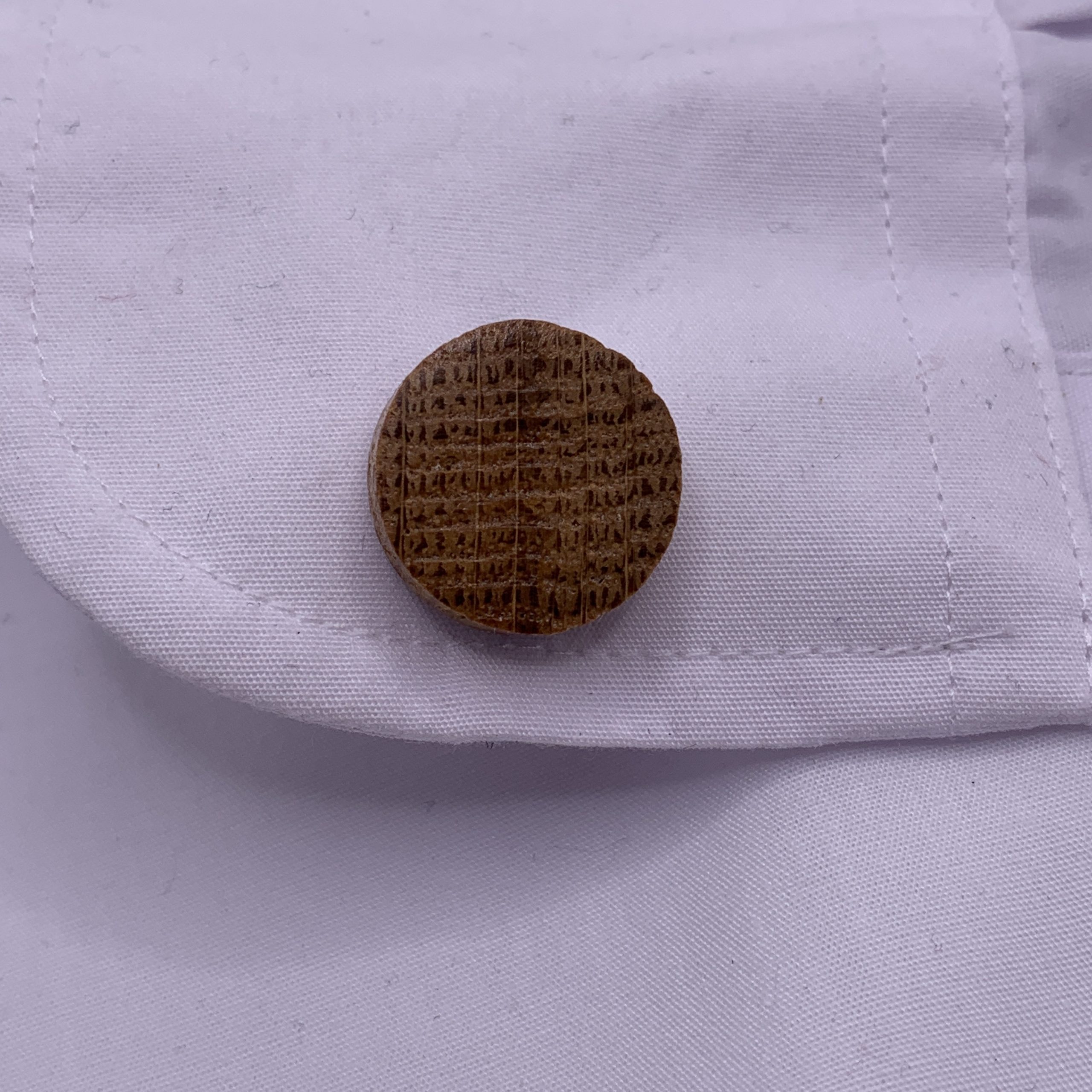 Circular shaped oak cufflinks handcrafted from a reclaimed whisky barrel stave