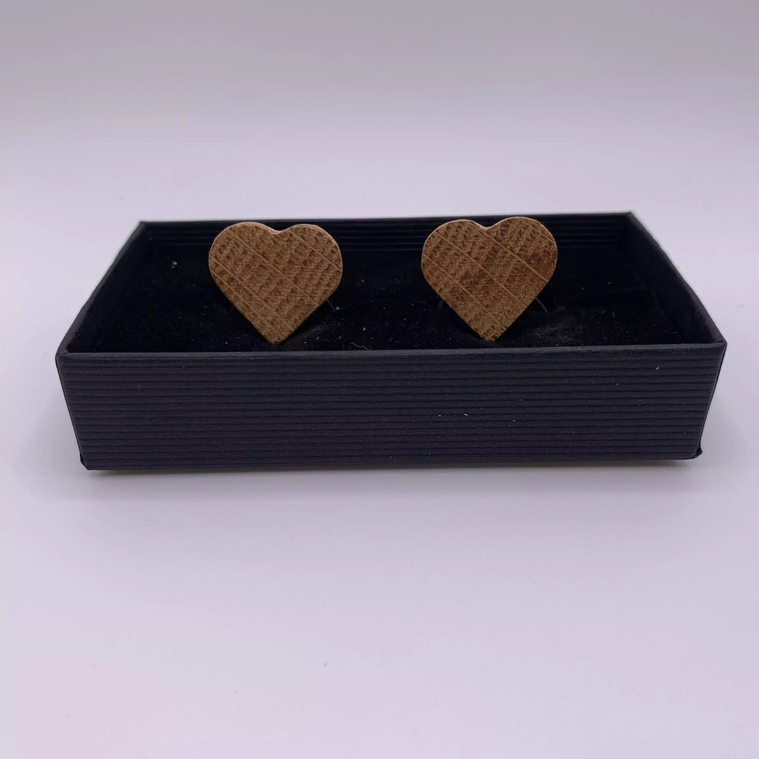Heart shaped oak cufflinks handcrafted from a reclaimed whisky barrel stave