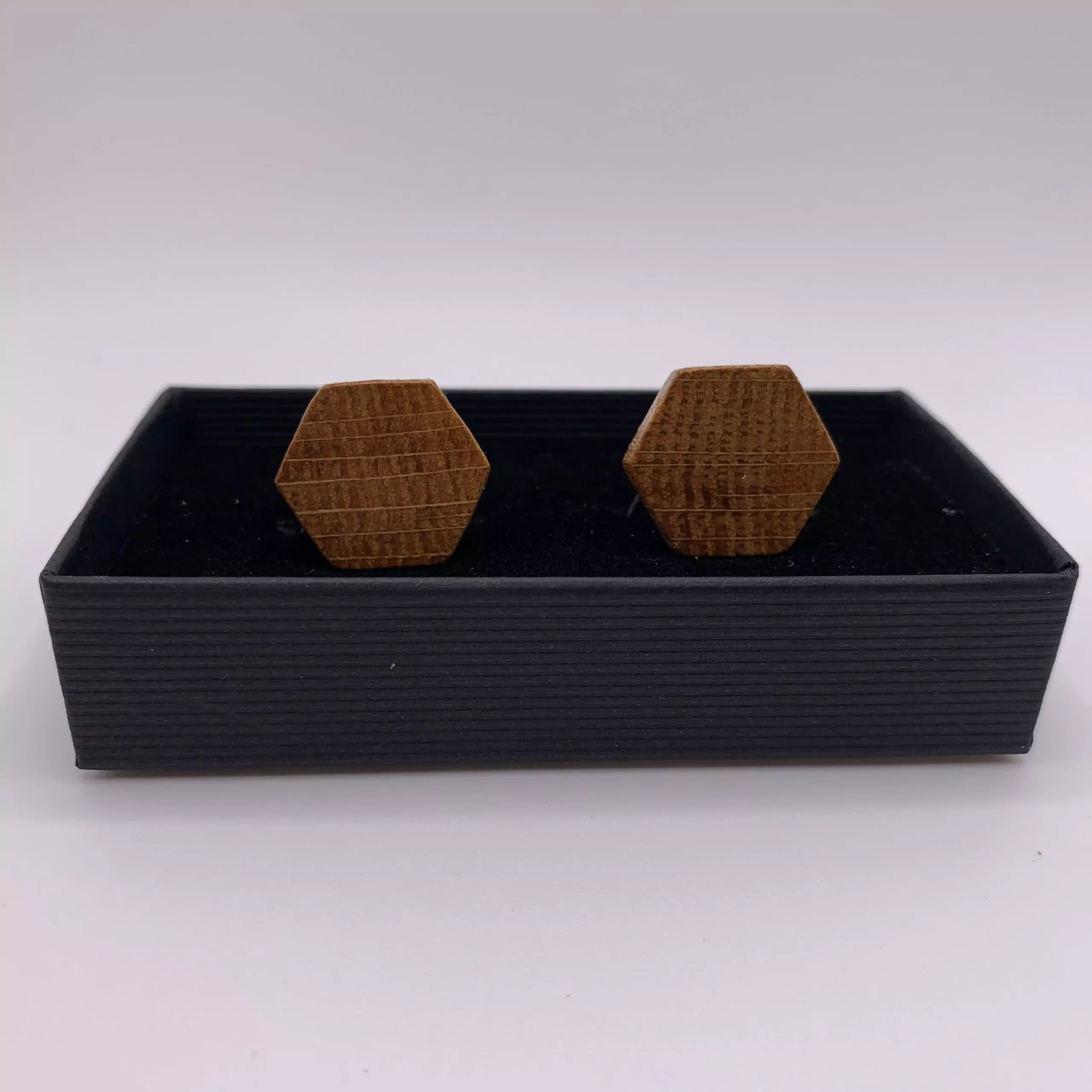 Hexagonal shaped oak cufflinks handcrafted from a reclaimed whisky barrel stave