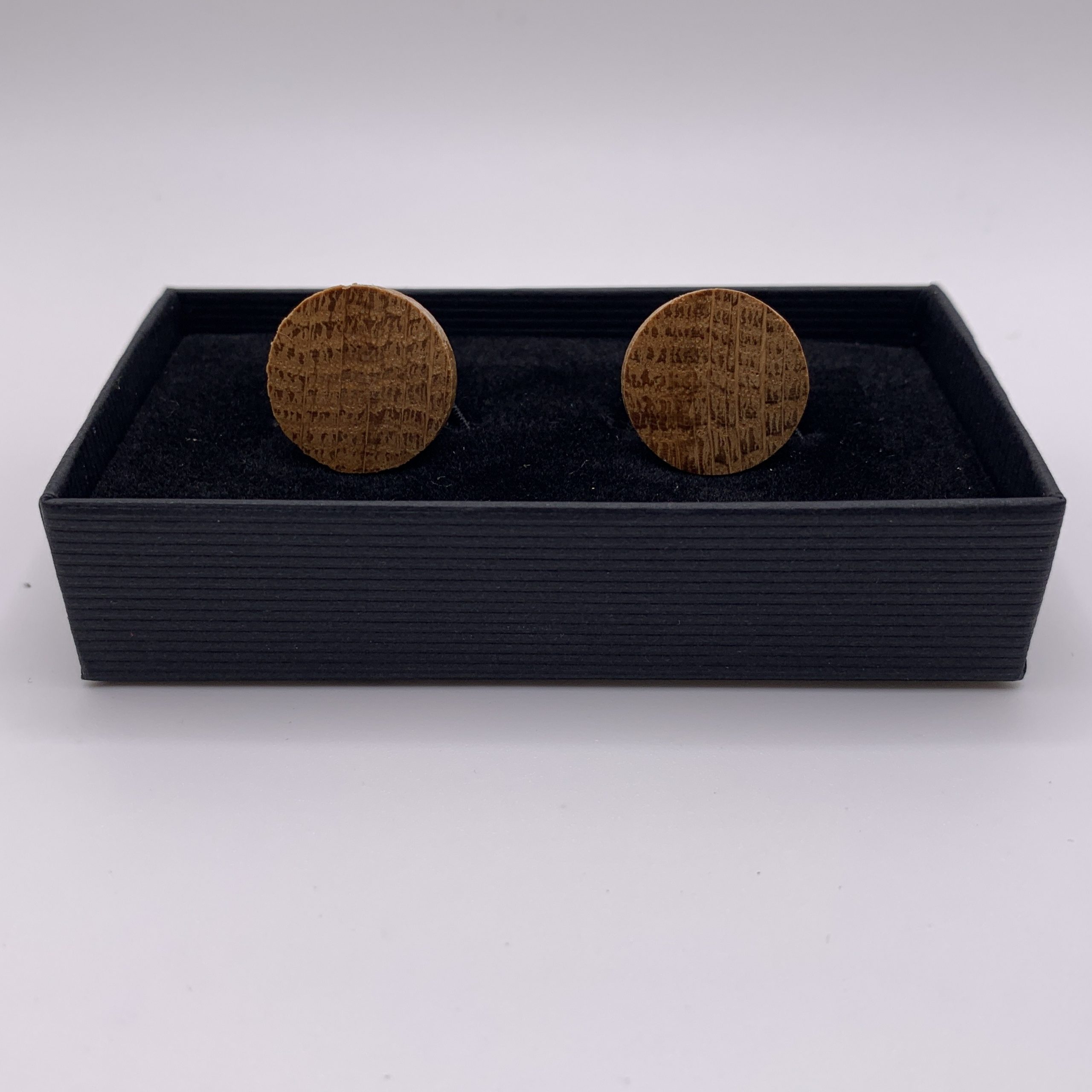 Circular shaped oak cufflinks handcrafted from a reclaimed whisky barrel stave