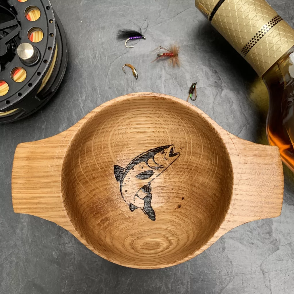 Handturned oak quaich with engraved rising trout design