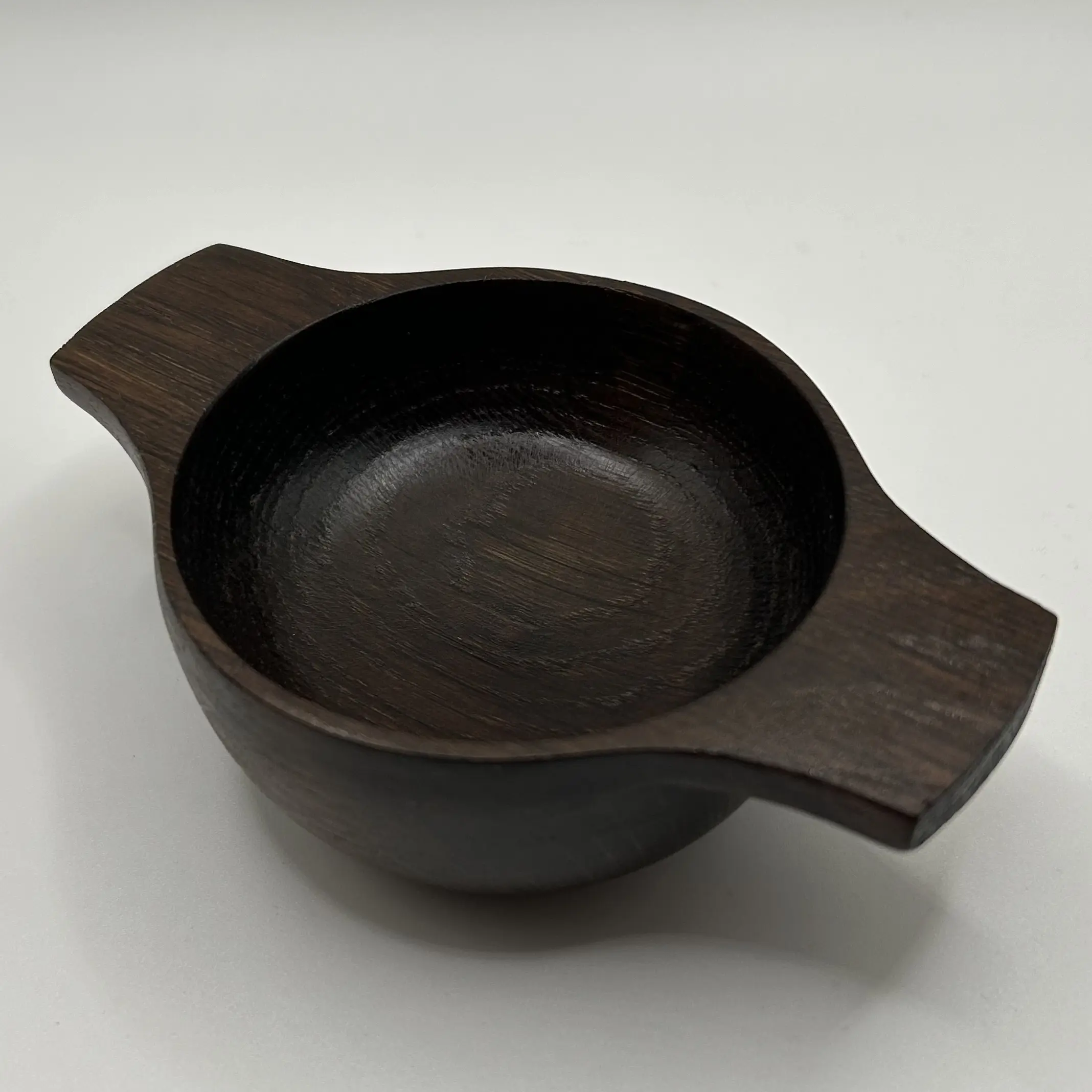 A hand turned oak fumed quaich
