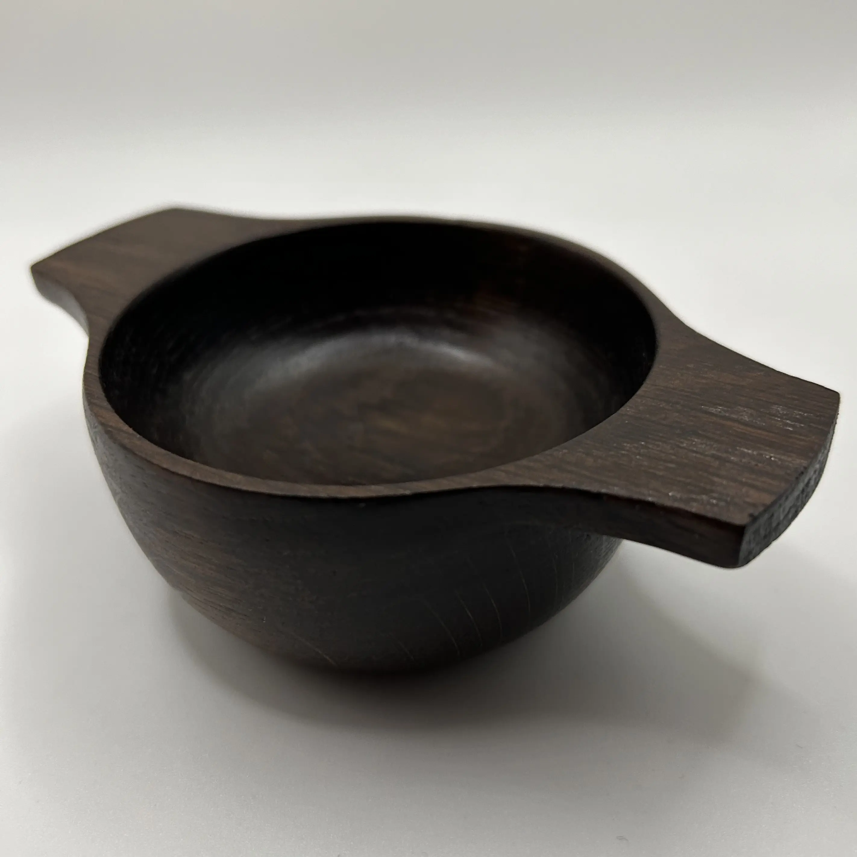 A hand turned oak fumed quaich