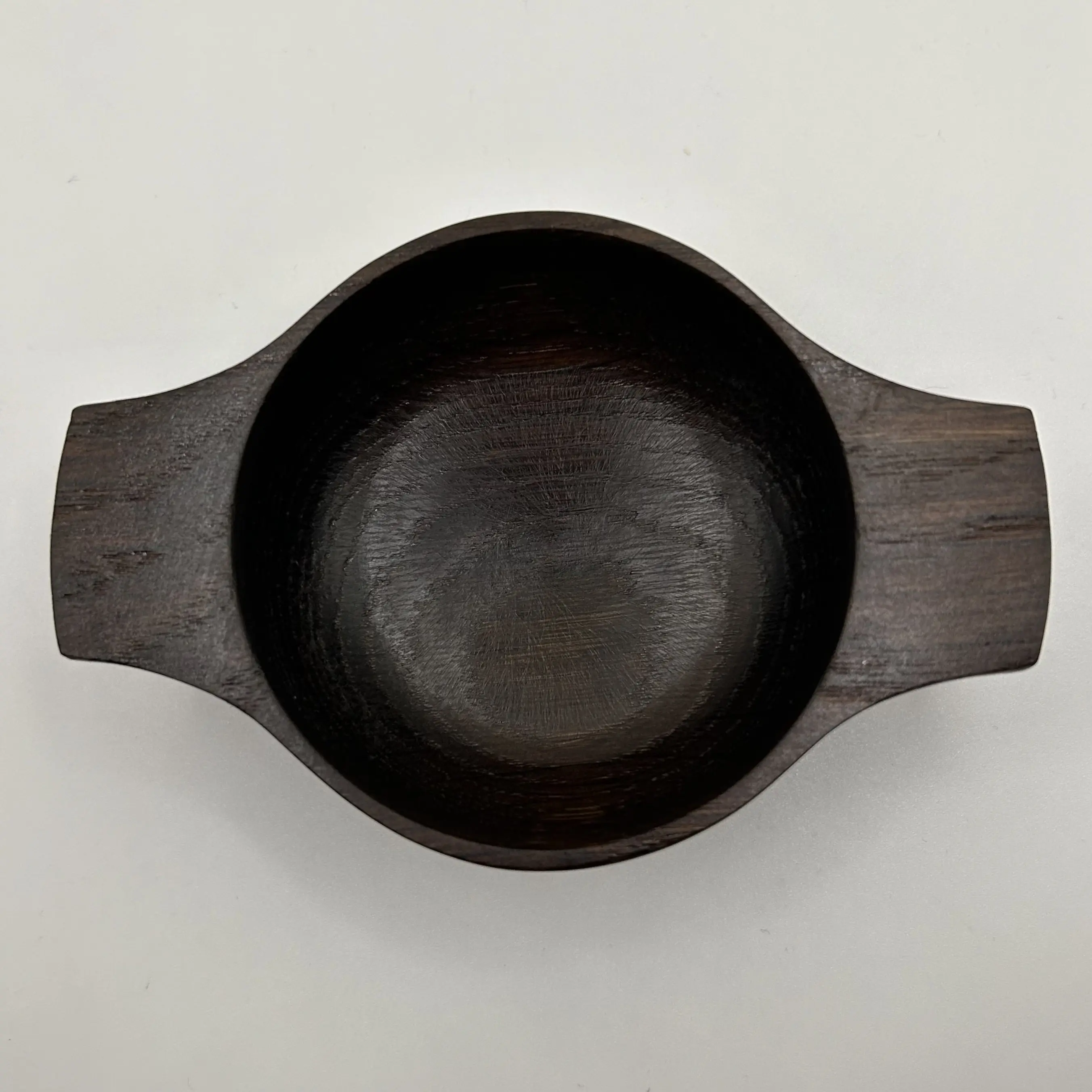 A hand turned oak fumed quaich