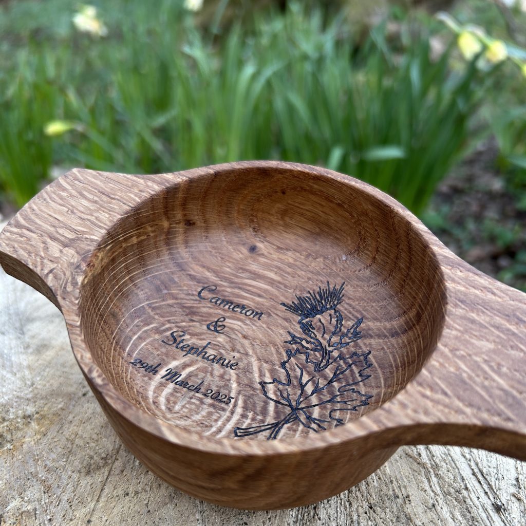 Handcrafted oak quaich personalised and engraved with the happy couples details